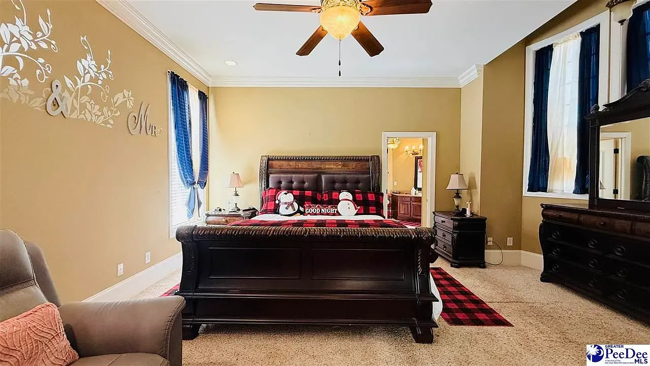 Warm beige bedroom with navy curtains. Simple, calm, looks comfy.