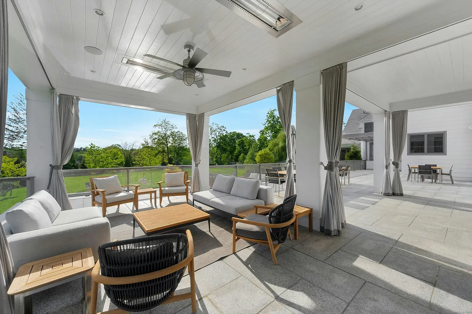 And then the indoor-outdoor lounge—huge openings, comfy seating. Anyone grilling later?