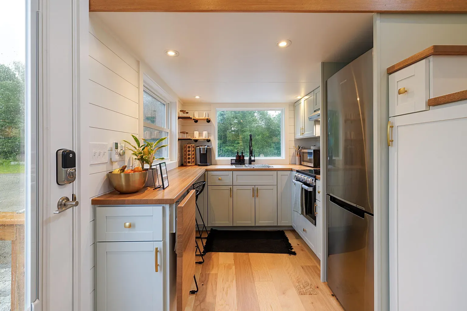 Light blue cabinets are doing it for me. Wood countertop warms everything up.