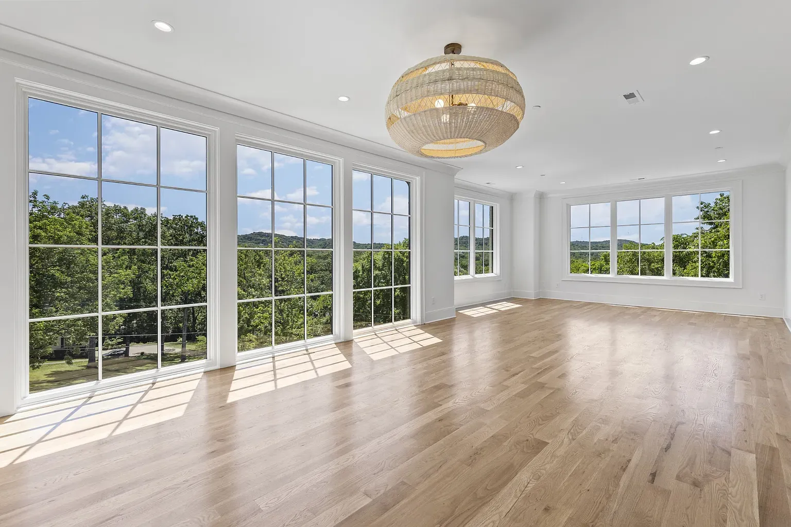 That view. Floor-to-ceiling glass and hills rolling on forever.