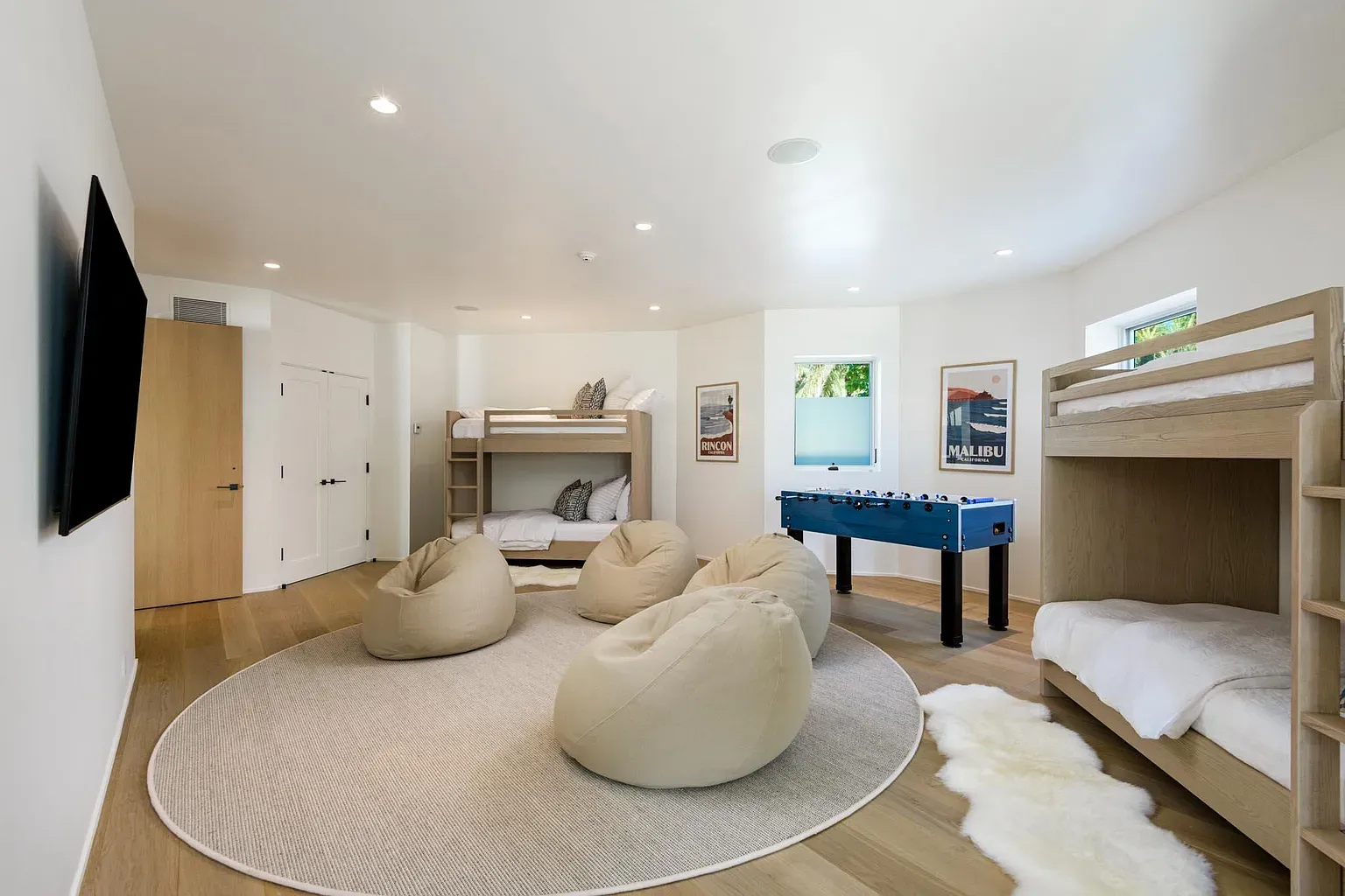Bonus room energy. Light floors, big windows, looks ready for board games.