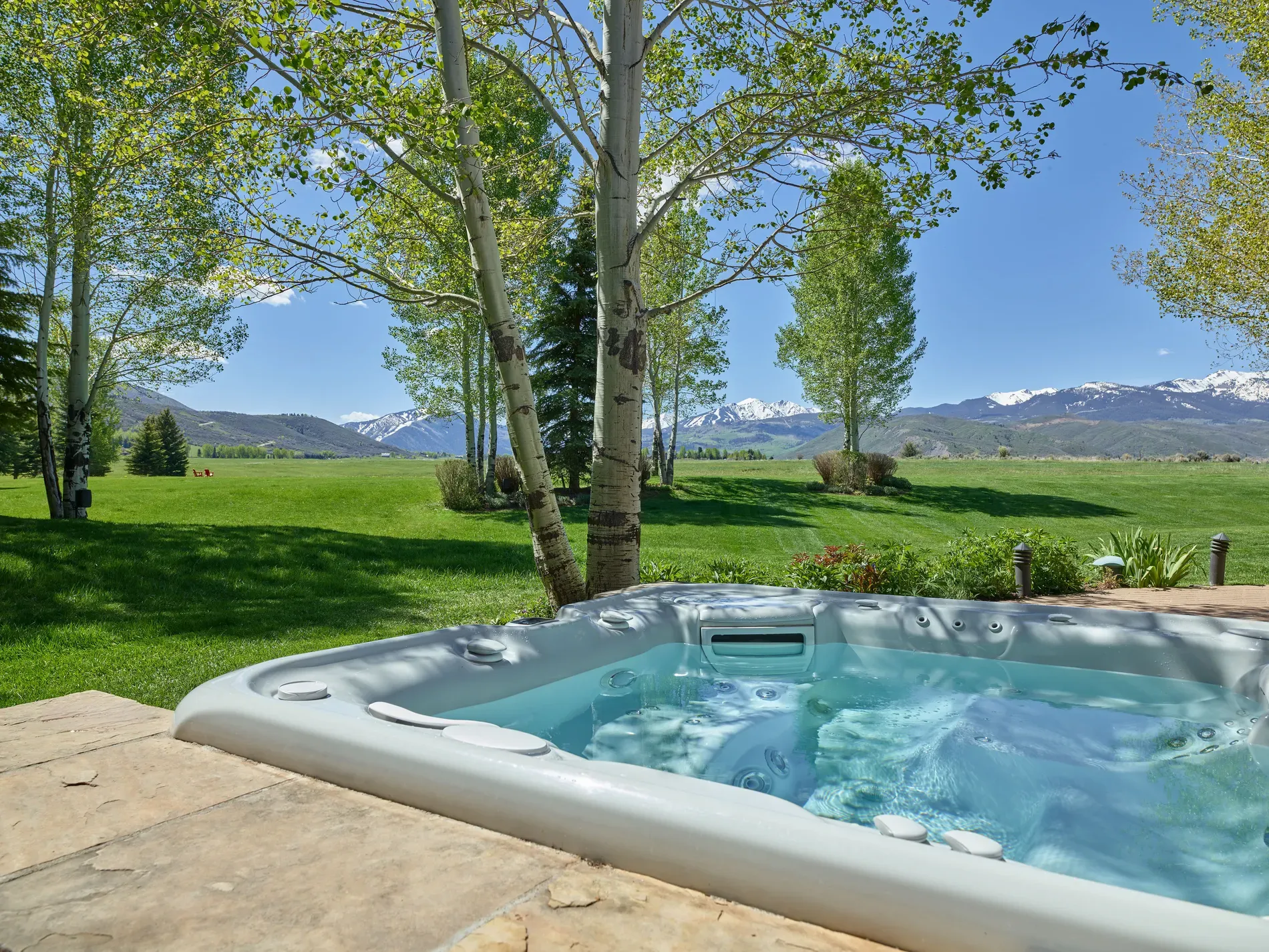And then a hot tub tucked into stone, lawn all around. Tempting.