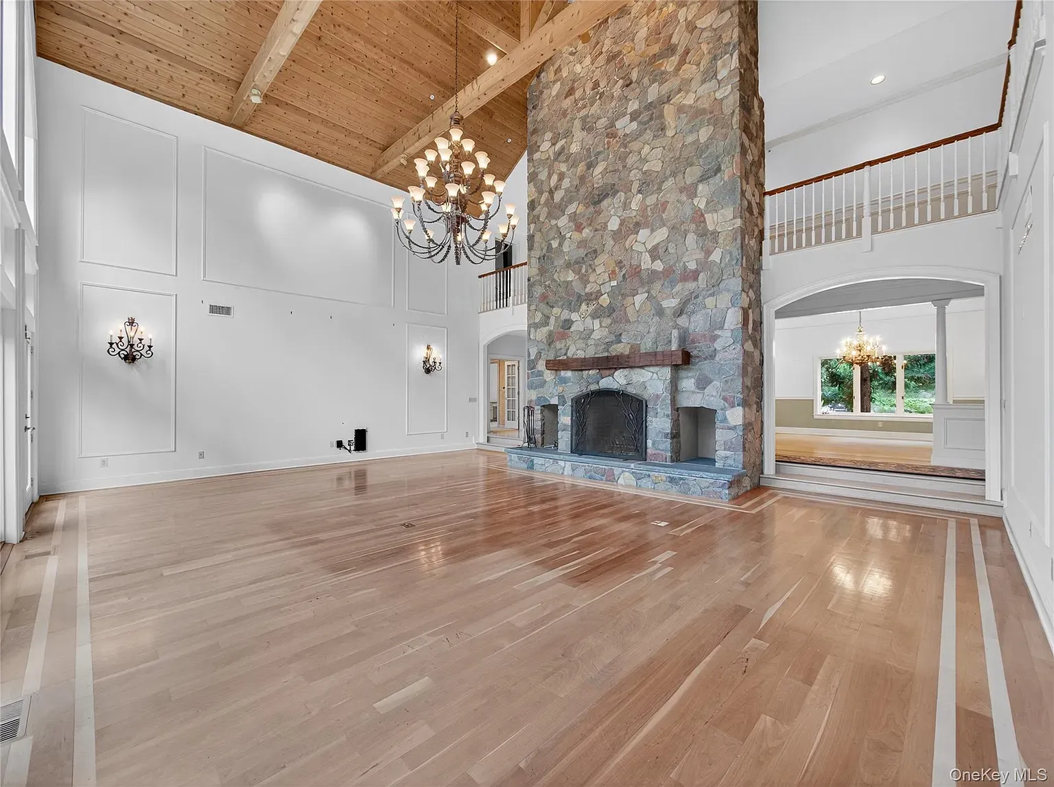 The floor-to-ceiling stone fireplace is the whole personality here.