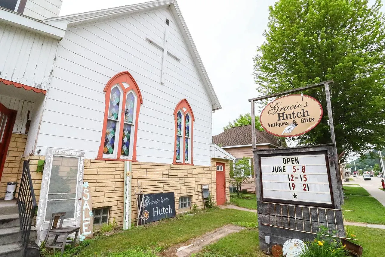 Gracie's Hutch exterior, white siding and pops of stained glass. Sweet little mashup.