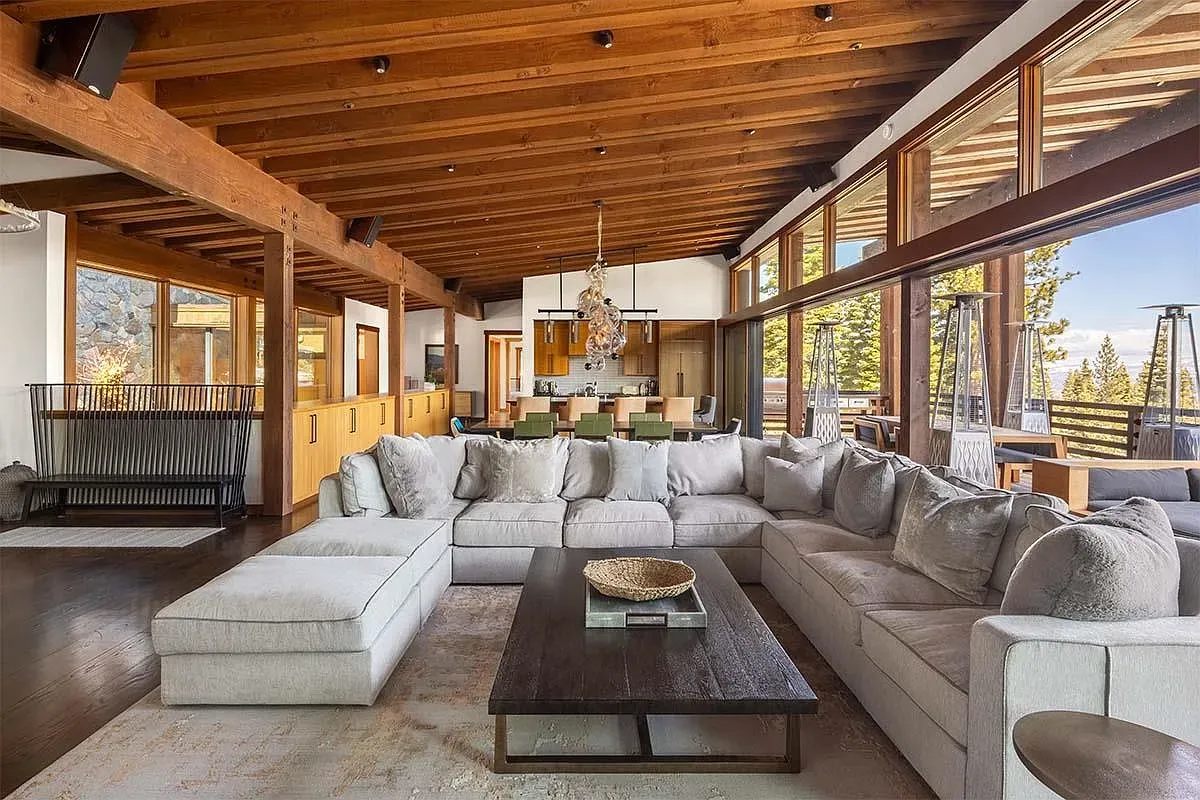 Open living room with a giant gray sectional. Feels ready for movie night.