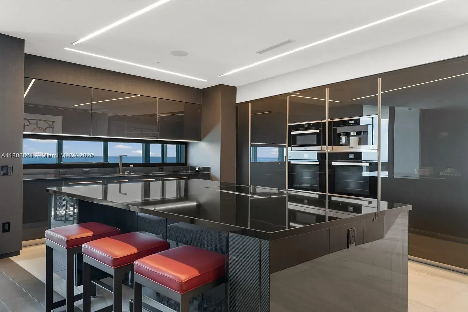 Here's the kitchen — black gloss everywhere. Looks slick, but fingerprints? Anyone got tips?