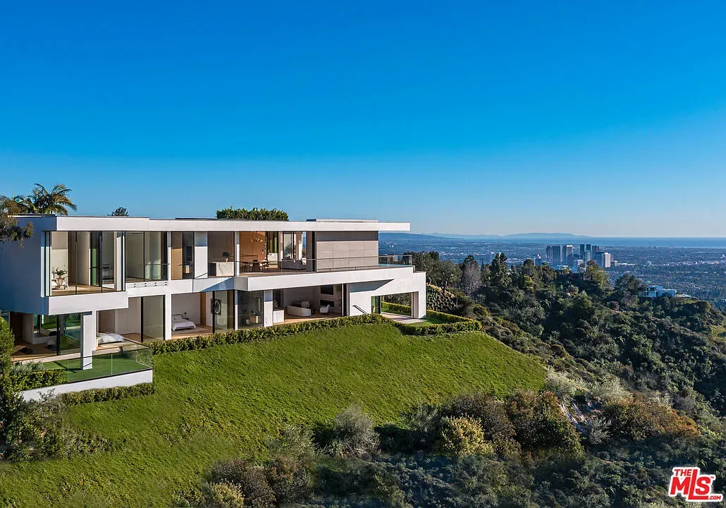 Here's the hillside hero — razor lines, glass everywhere, city views for days.
