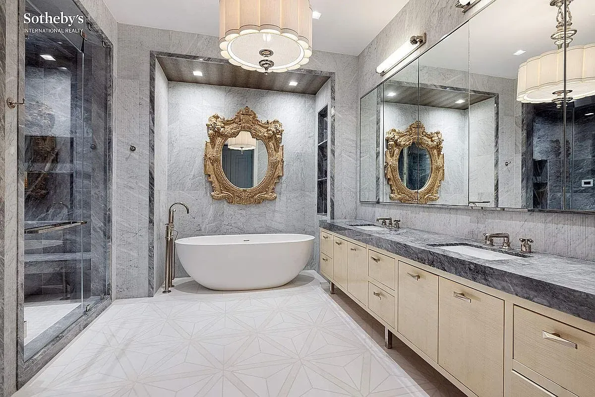 Soaking tub against veined marble. Spa ad vibes. I’d never leave.