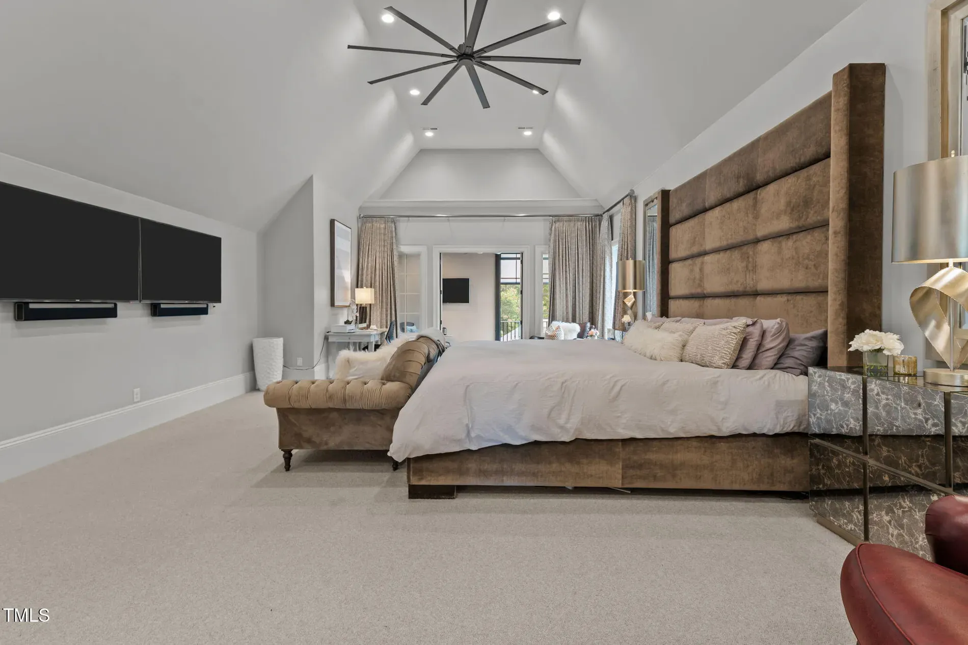 Primary suite with a windmill fan. Vaulted, quiet gray—sleep machine.