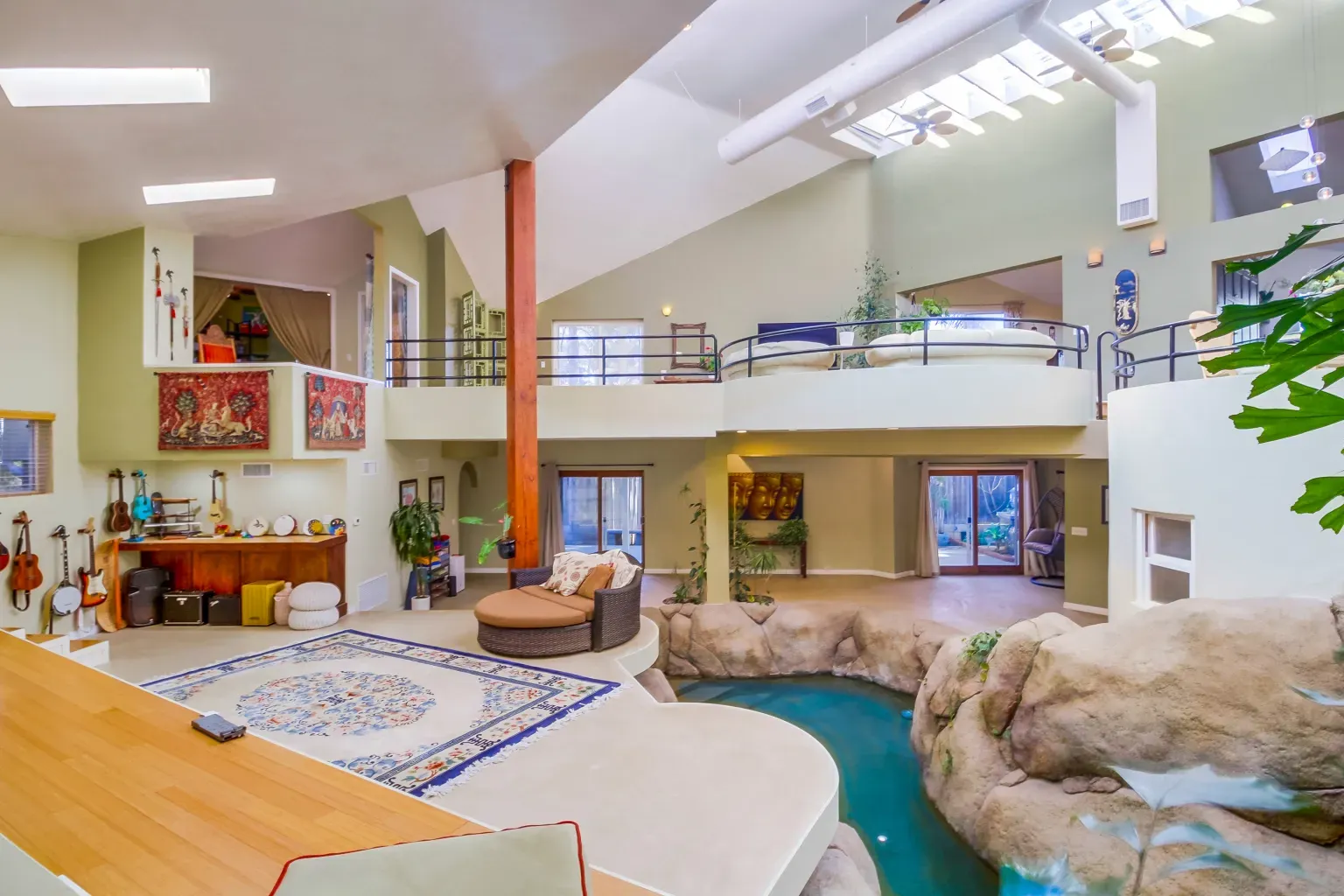 Big open room in muted green. There's a centerpiece I can't quite read.