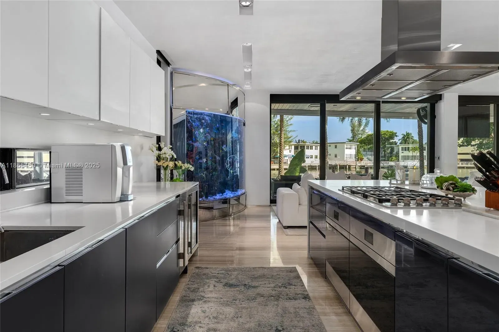 Okay, this kitchen—glossy black cabinets against bright white counters. Showroom sleek.