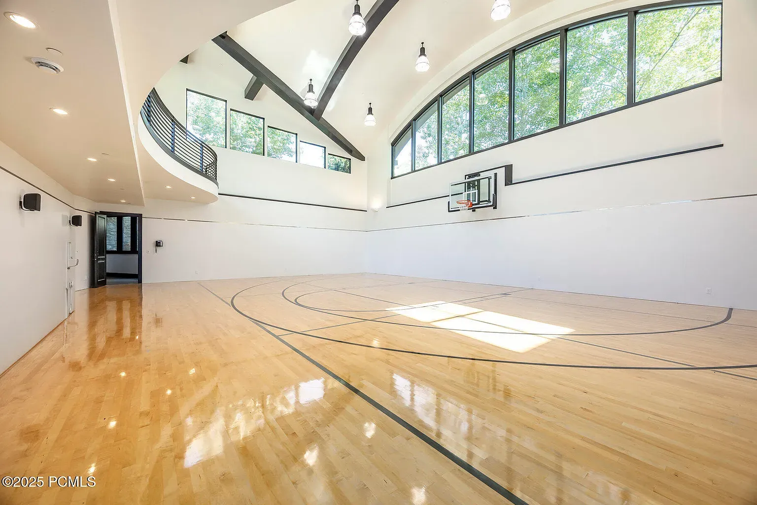 Full-on indoor court. Arched windows make it feel a chapel of hoops.