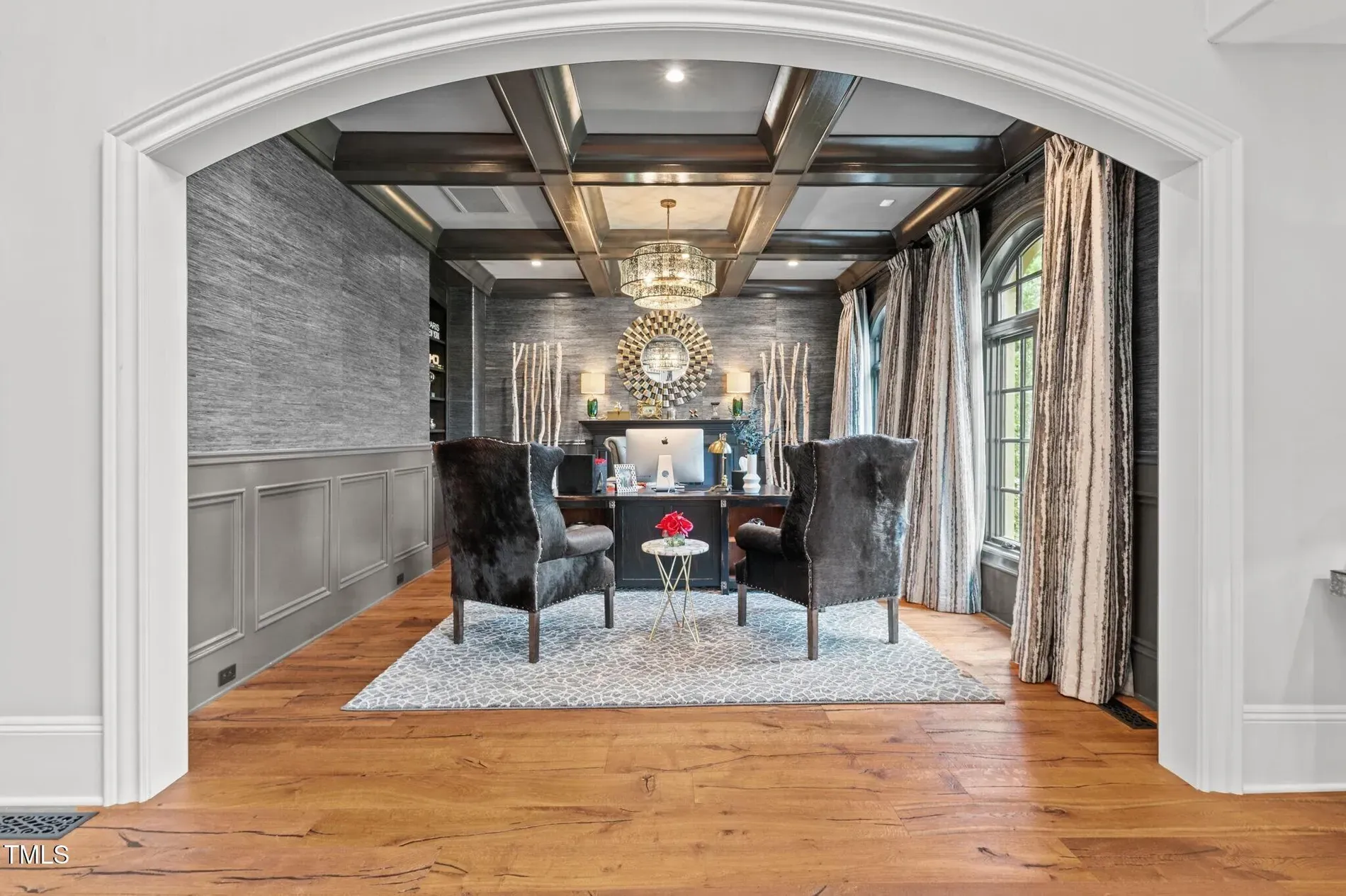 Coffered ceiling alert. Dark wood over honey floors—rich but not stuffy.