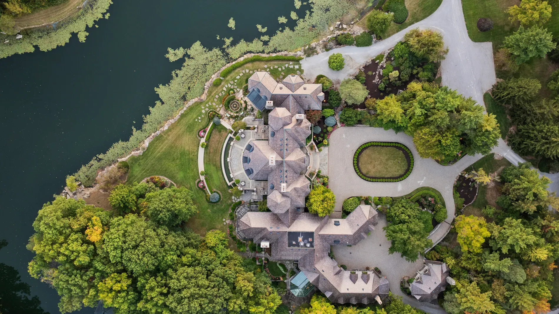 Drone shot with lake, steep roofs, lots of wood and stone.