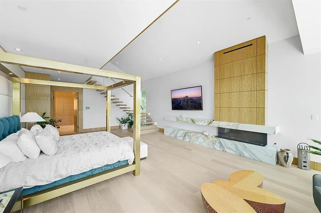 Gold four-poster steals the room. Everything else stays quiet and serene.