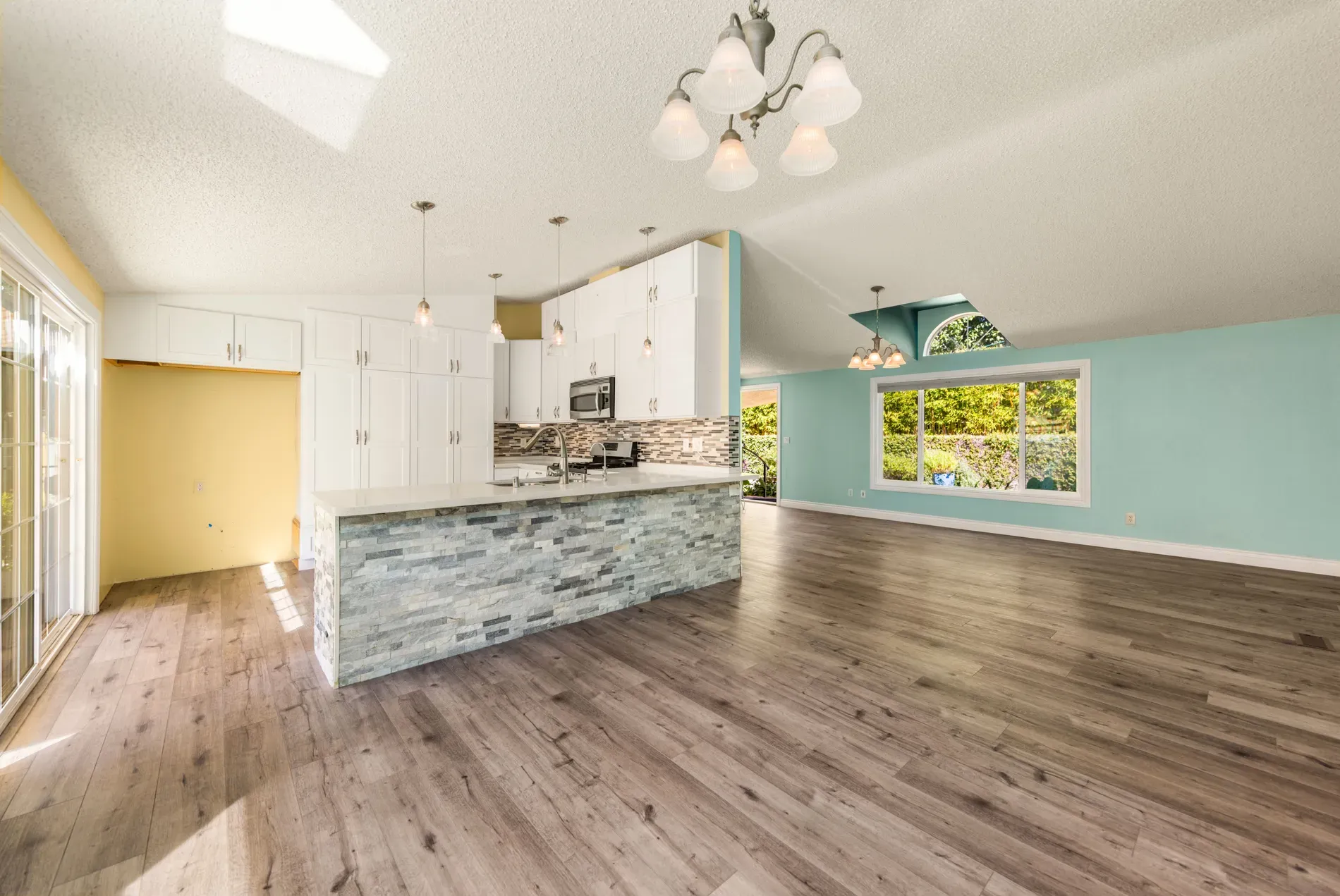 Open living area, big windows, soft mint walls. Easy breezy.