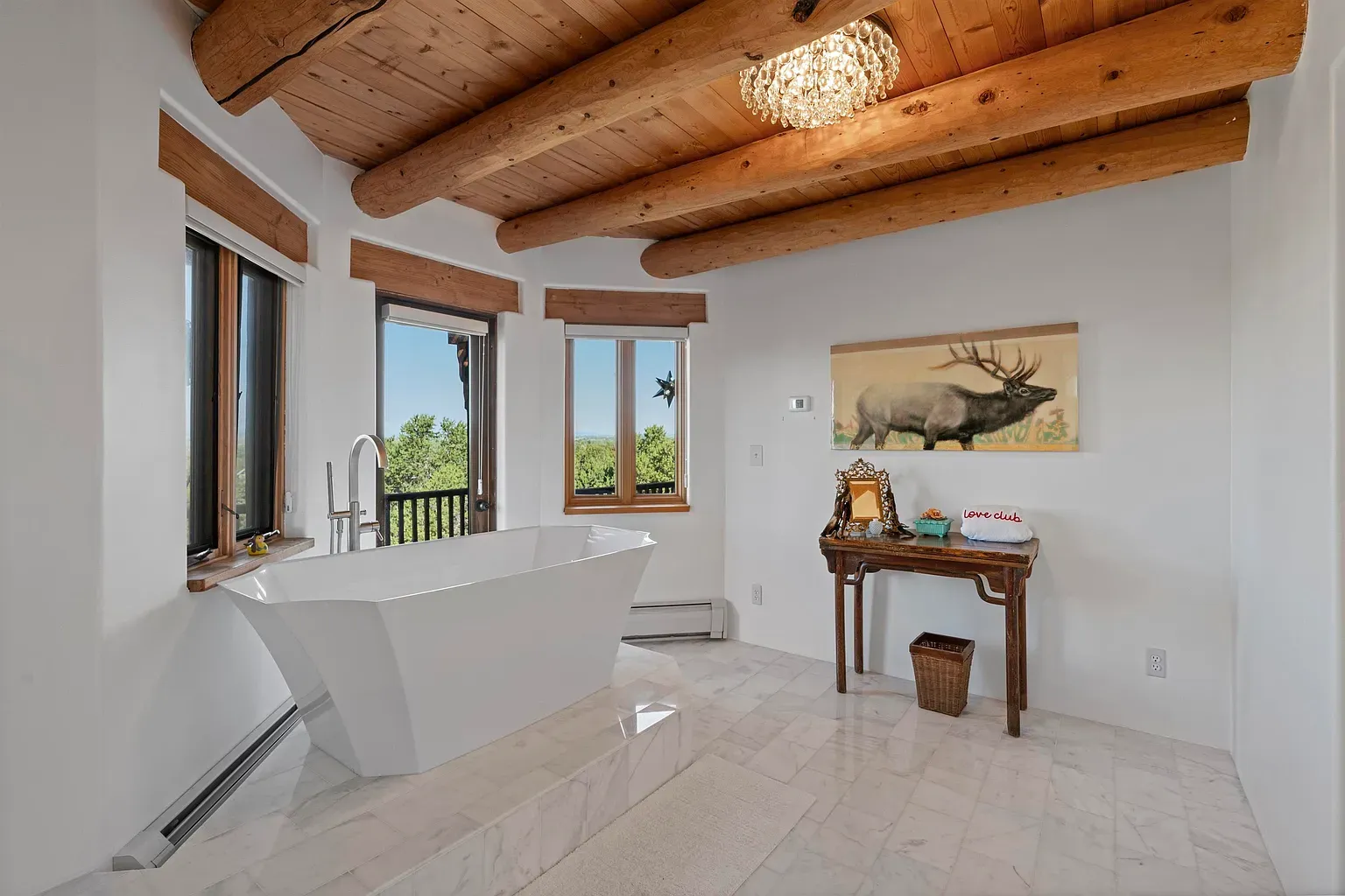 Tub with window views. Minimal lines meet earthy textures. Immediate exhale.