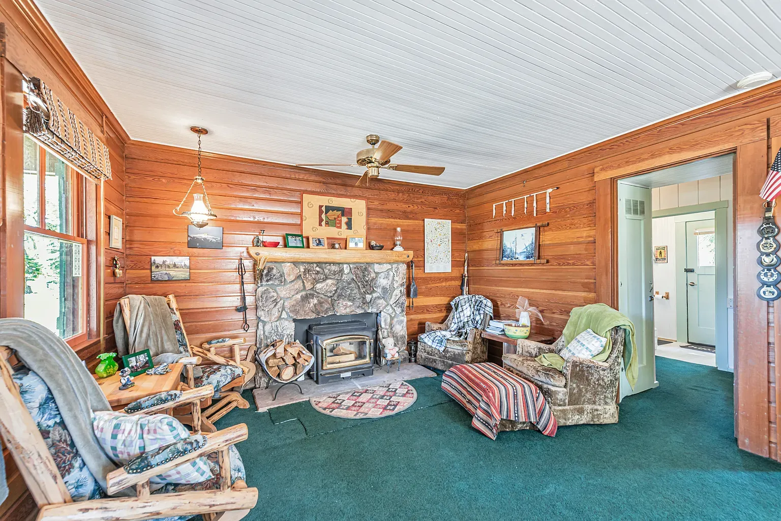 Wood-paneled room with white ceiling. Feels a board game night waiting to happen.