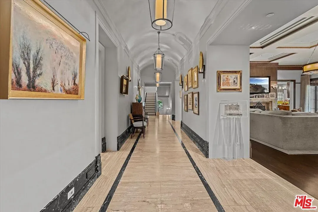 Long corridor, high ceilings, warm lighting. Feels fancy but welcoming.