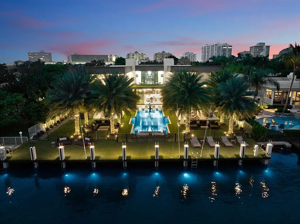 Two-story glass box on the water. Beige stucco actually looks elegant here.