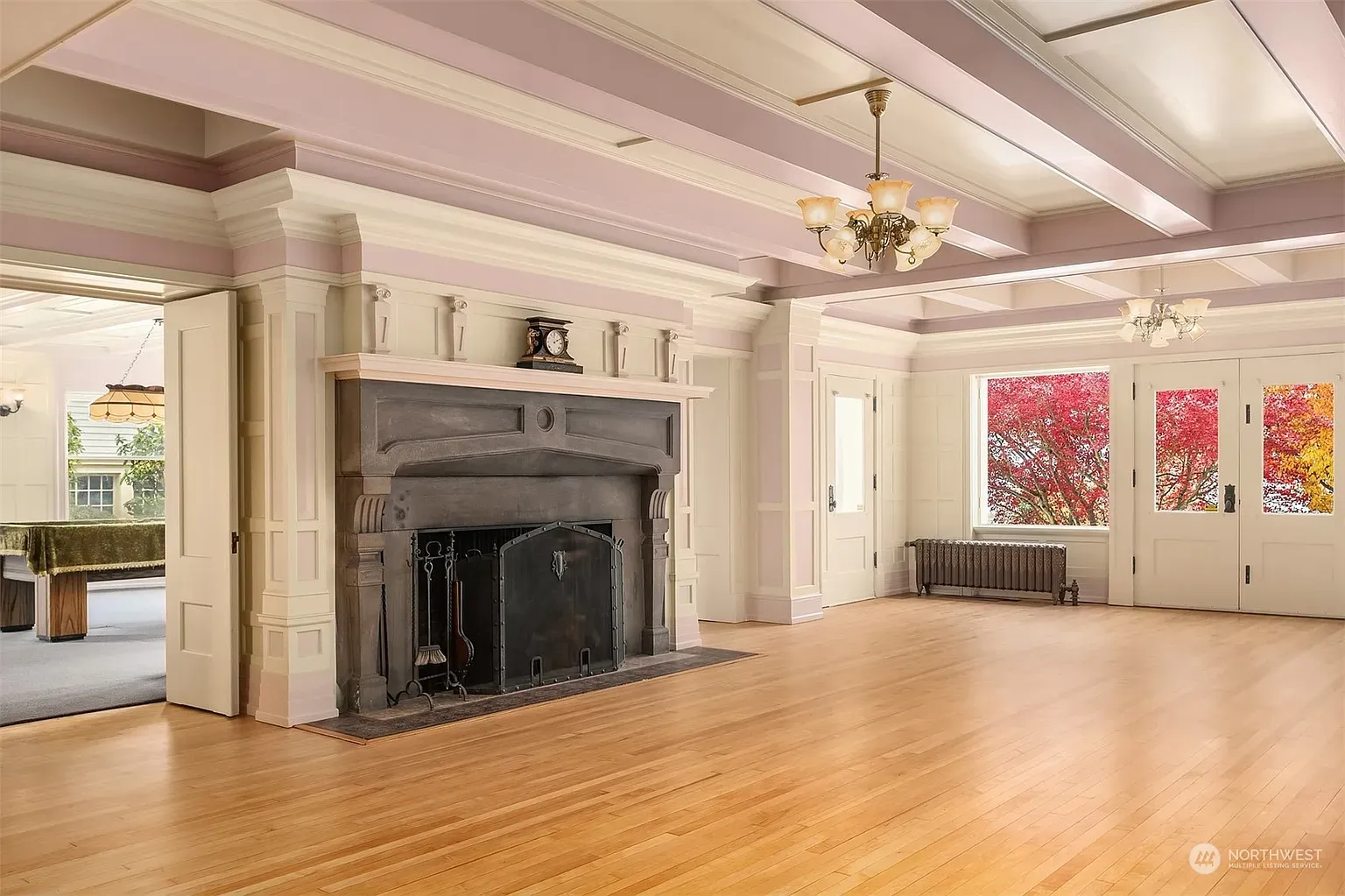 That dark stone fireplace is serious. Ironwork detail, perfect for cold nights.
