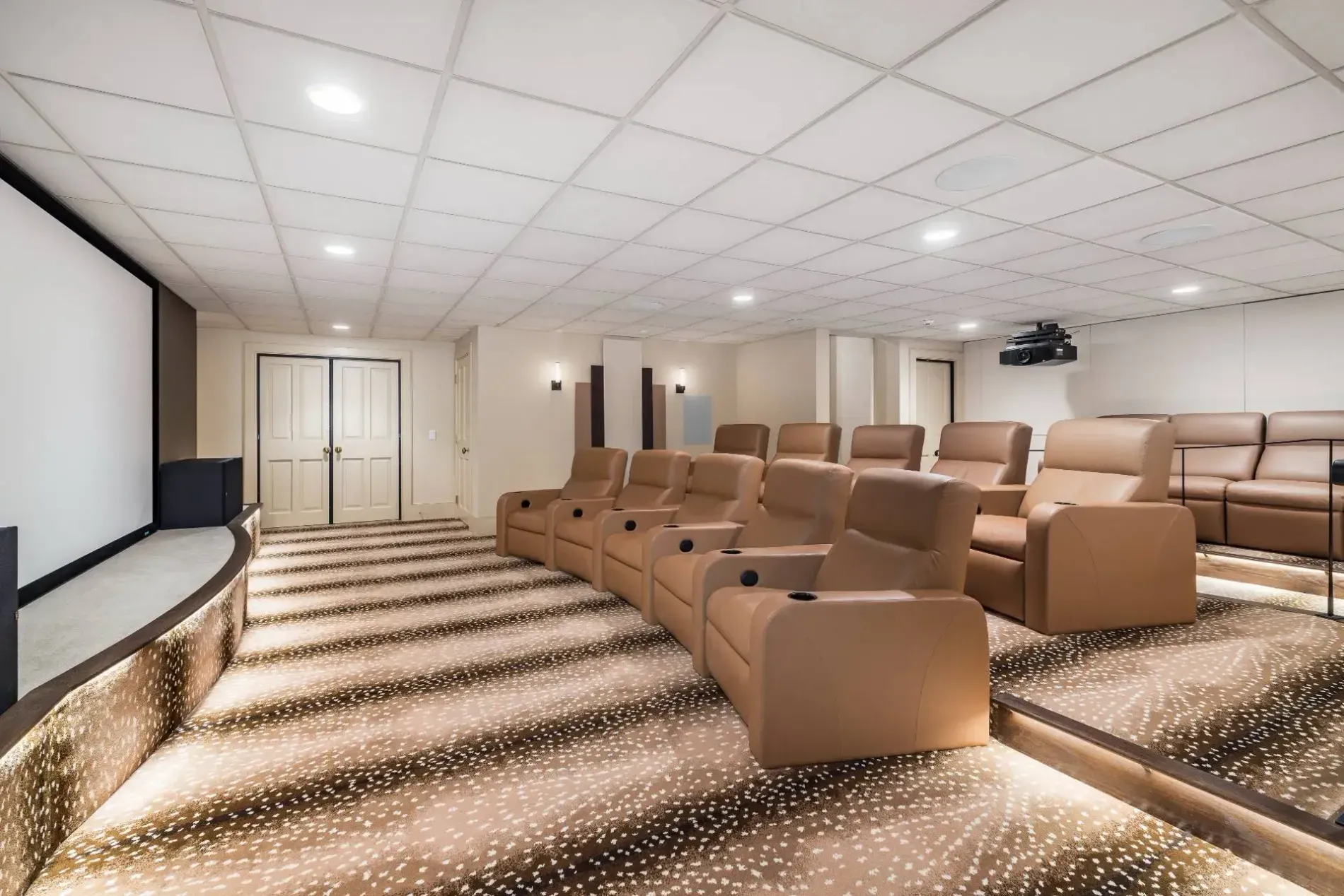 Not sure about this combo—brown recliners and patterned carpet. Comfy, though.