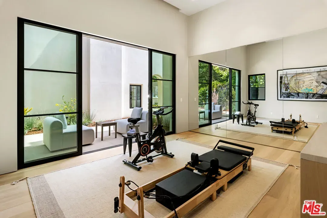 Gym with wall-to-wall glass. Lift, then stare at trees.