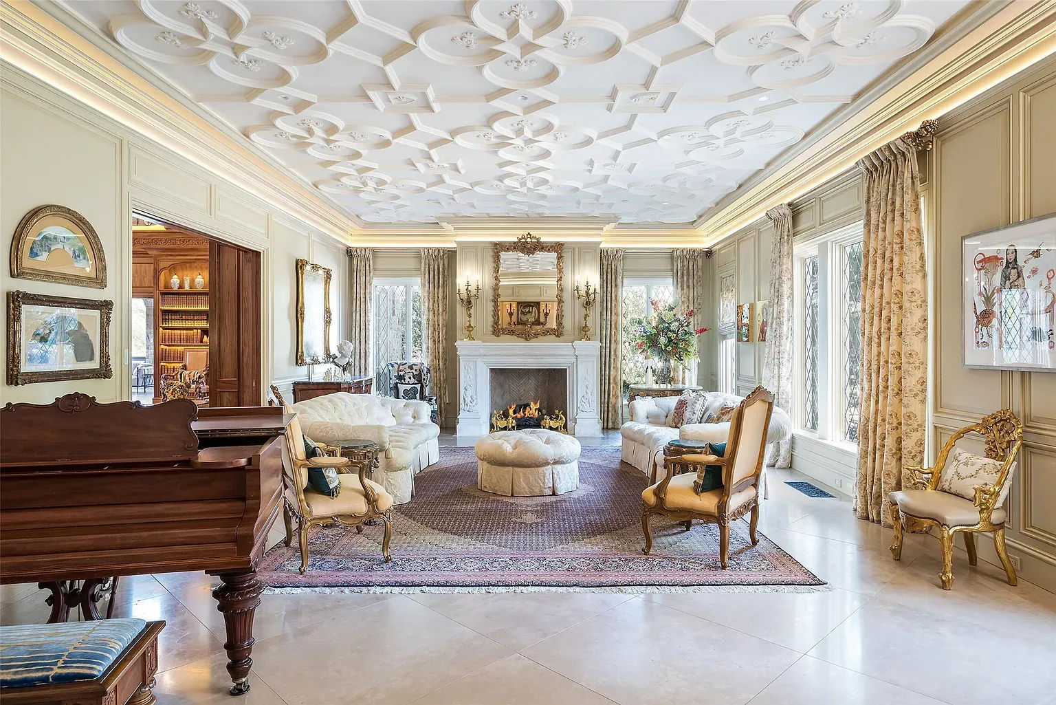 Formal living with a wildly detailed ceiling. The room is basically the trim.