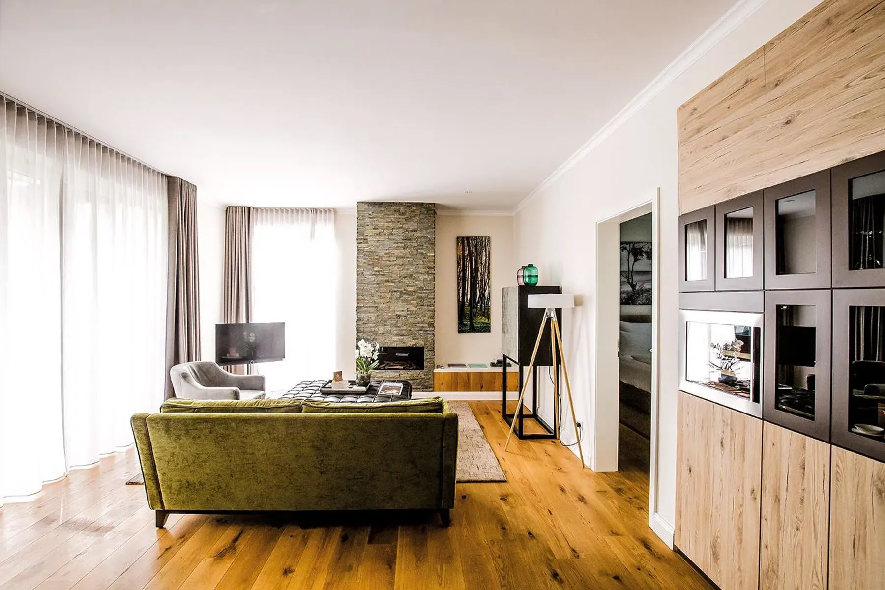 Tall windows, sheer curtains, warm floors. Afternoon nap loading.