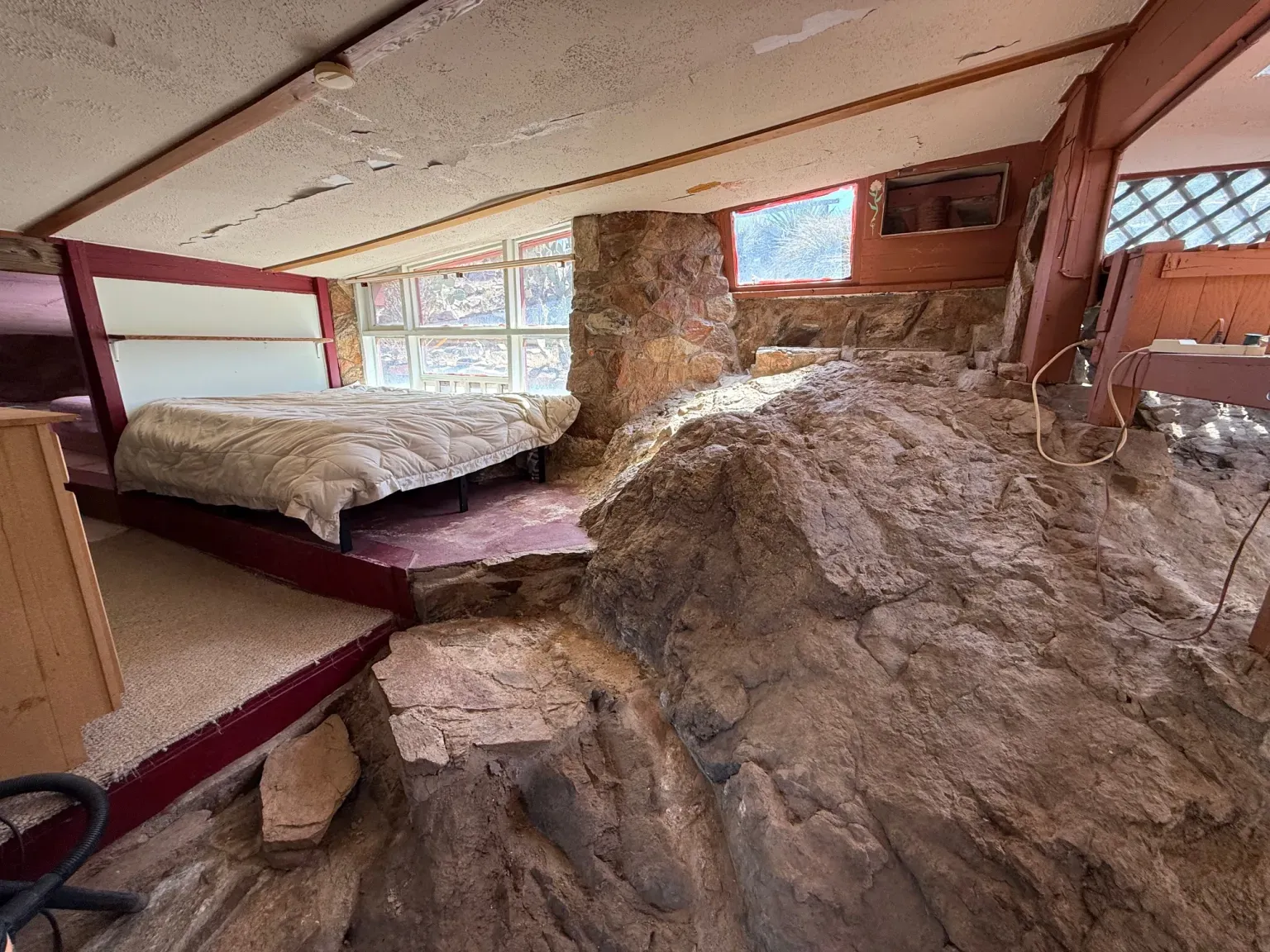 Actual boulders in the room. Feels camping, but with outlets.