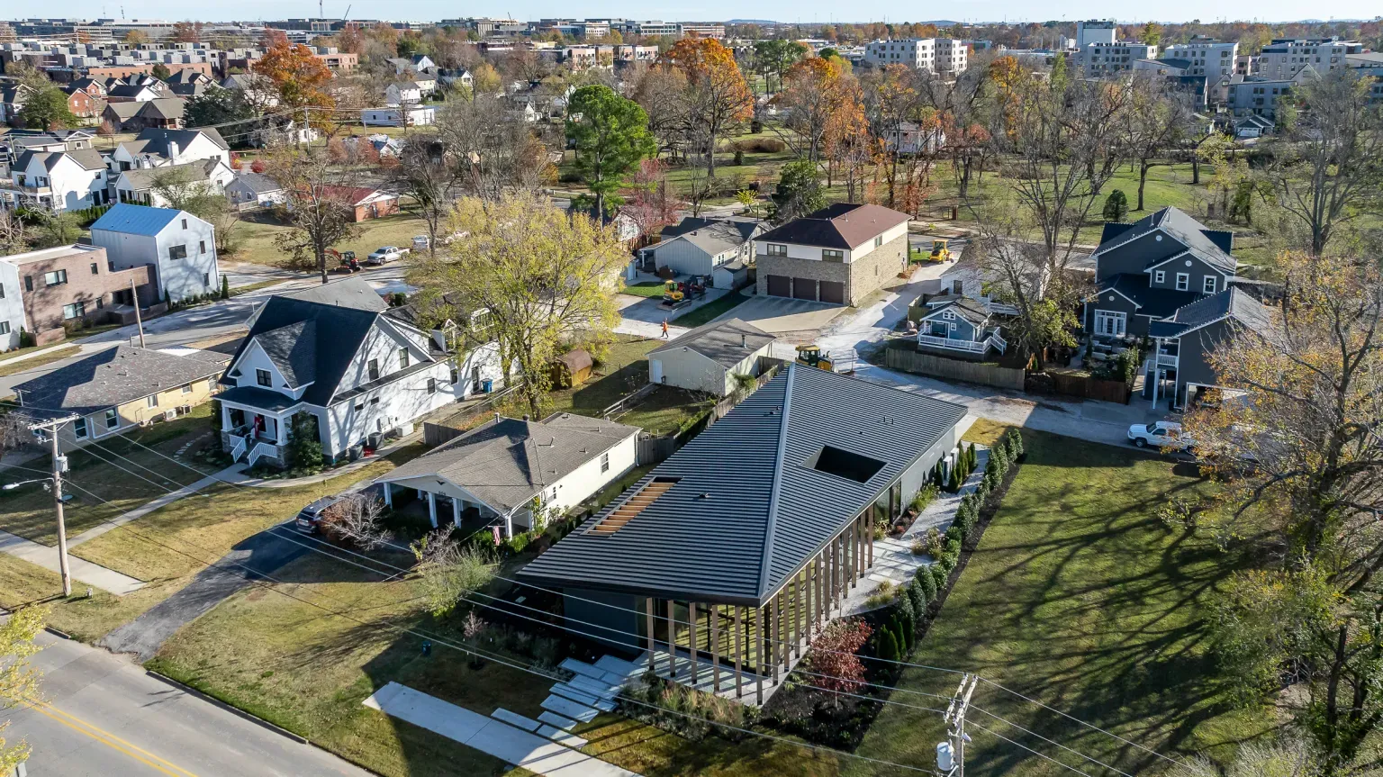Neighborhood shot with the angular roof and full-on autumn colors.