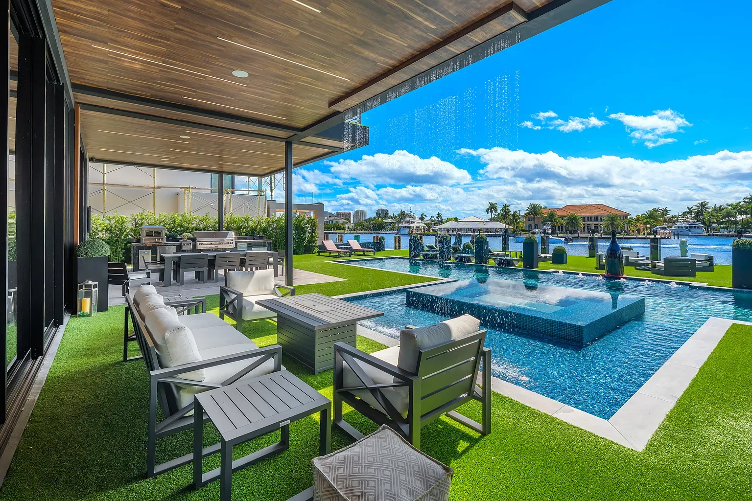 Outdoor lounge with ocean energy. Cushions look nap-ready.