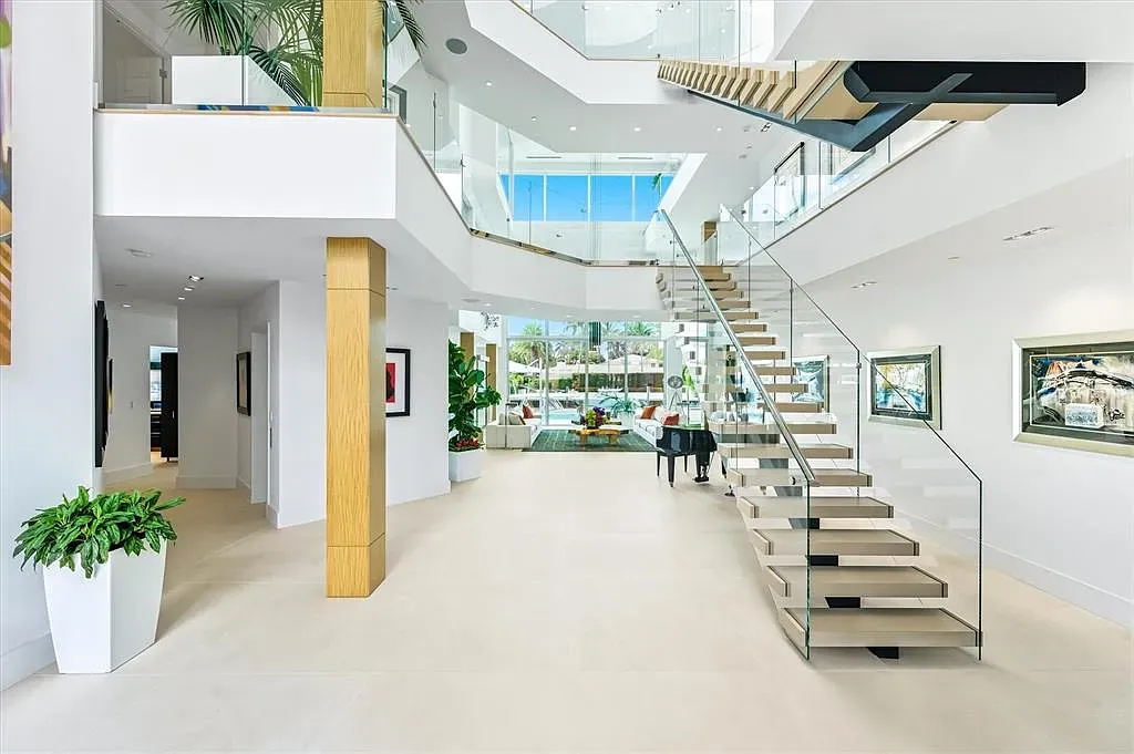 Double-height entry again, but this angle shows the view swallowing the room.