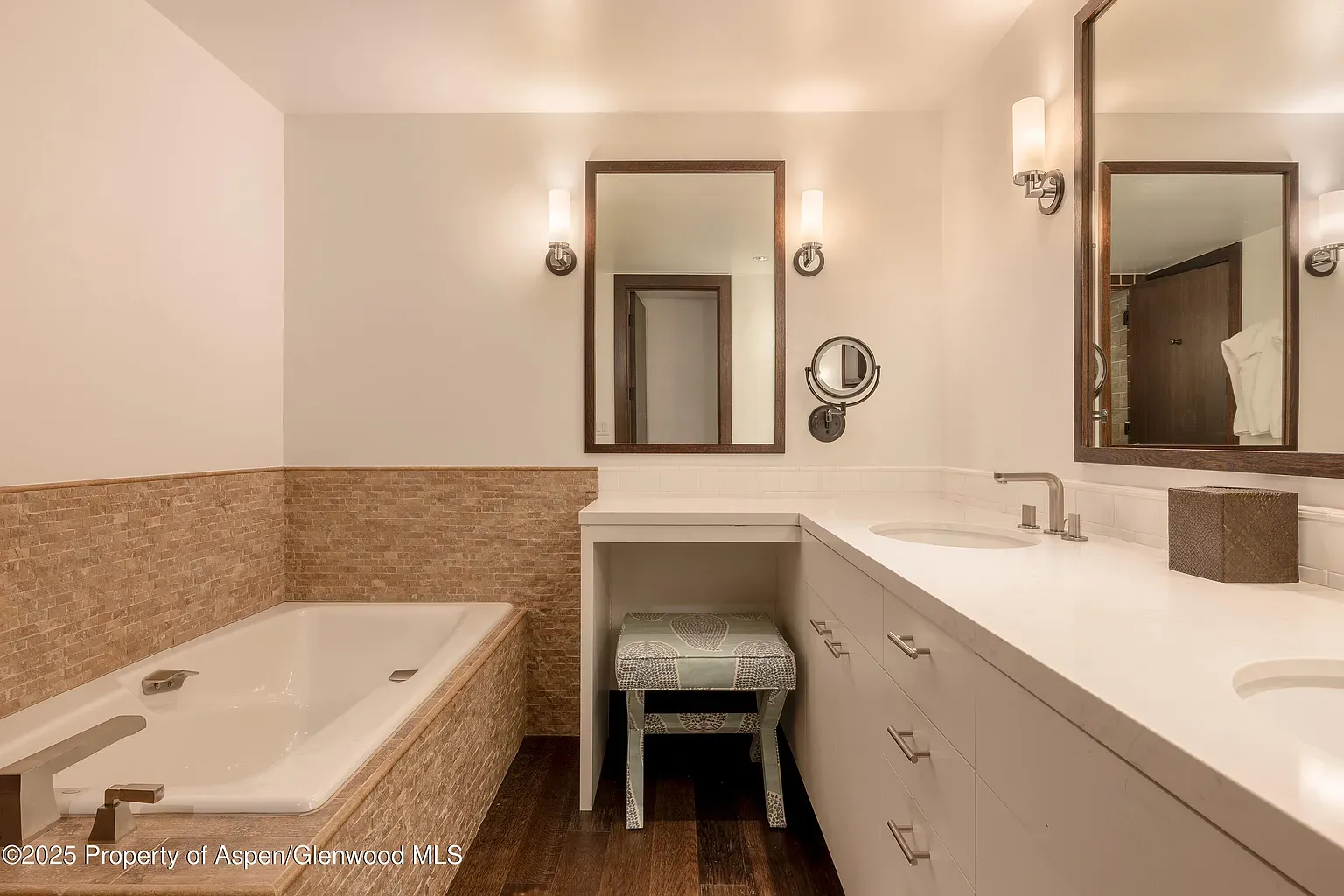 Creamy bathroom and a freestanding tub begging for an hour of silence.