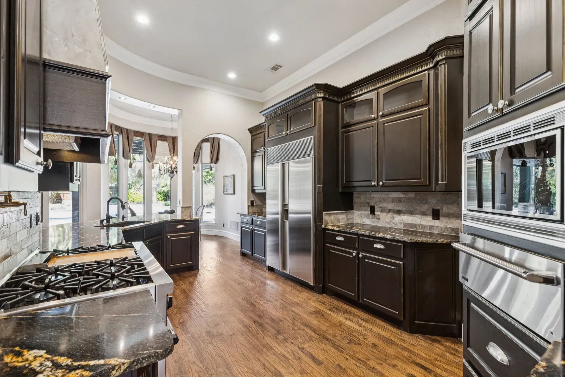 Open kitchen again. curved wall moment. From this angle, the flow makes sense.