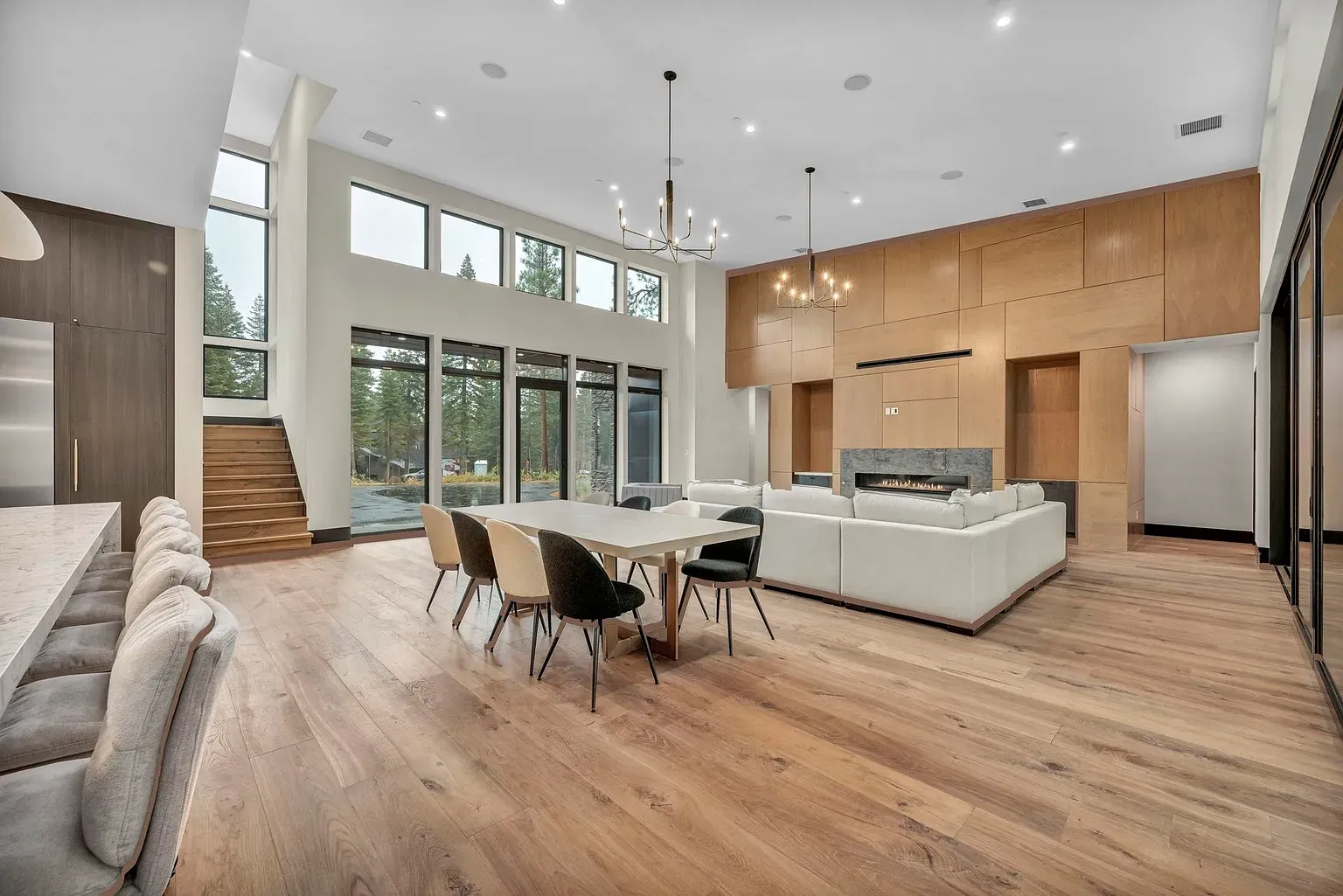 Big windows, warm floors, furniture floating nicely in the open plan.