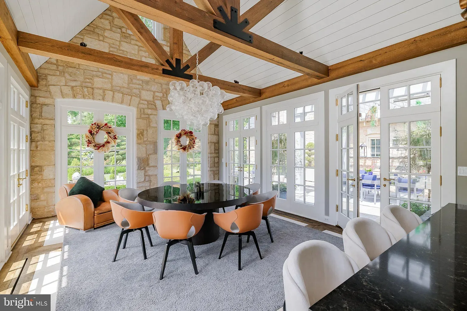 Here's the vaulted dining—beams and stone everywhere. Airy and warm.