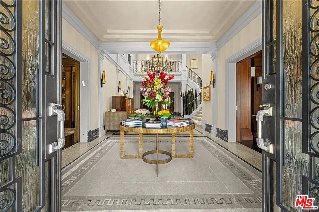 Double doors with black frames and frosted glass. Clean, bold foyer moment.