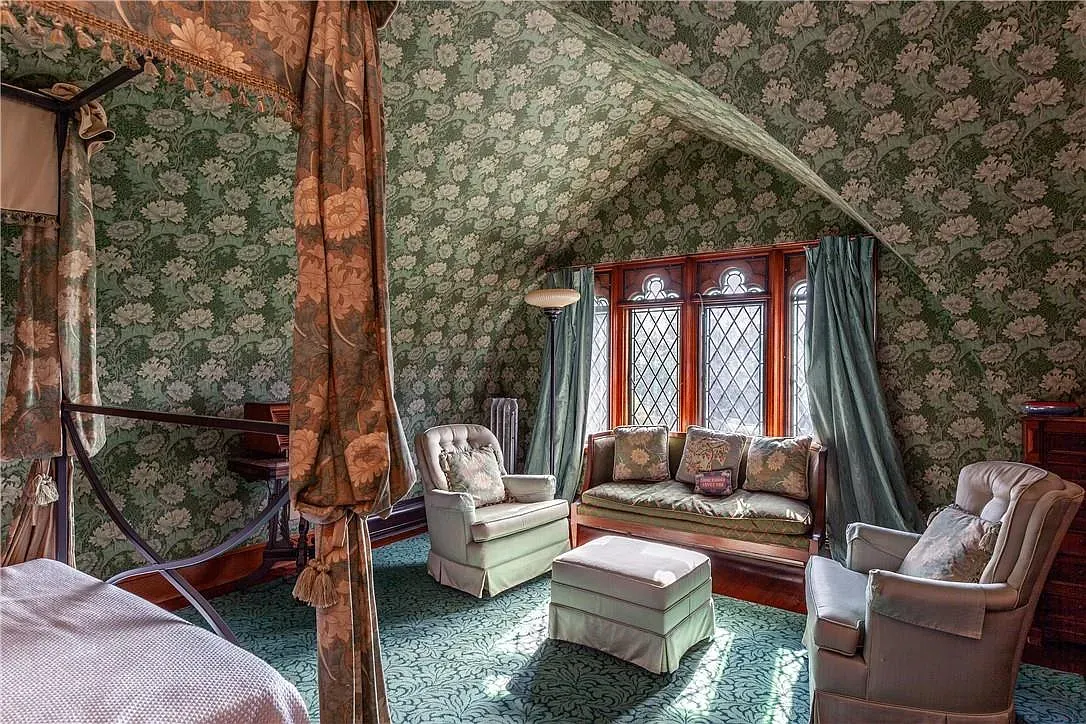 Sloped ceiling moment. Green floral paper somehow works.