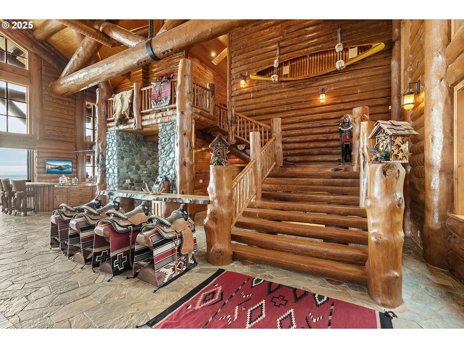 Entry is a cathedral of beams. You look up first, then everywhere else.