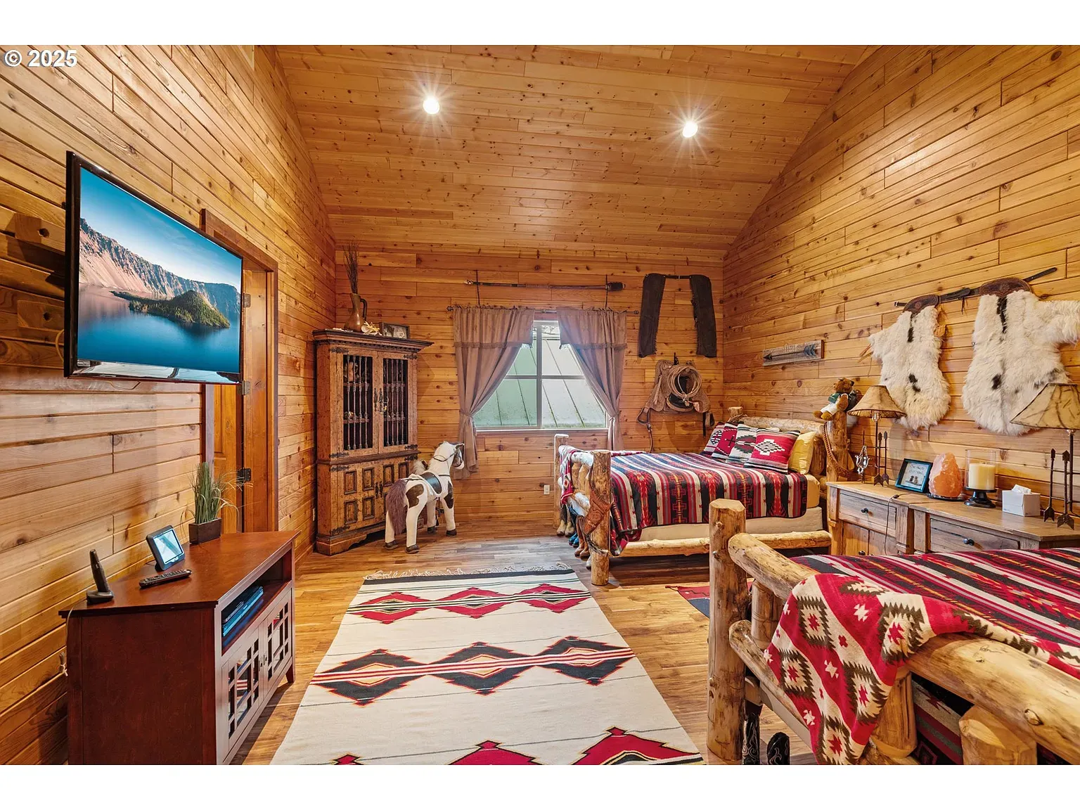 Bunk room vibes, but fancier. Log bed frames and matching nightstands.