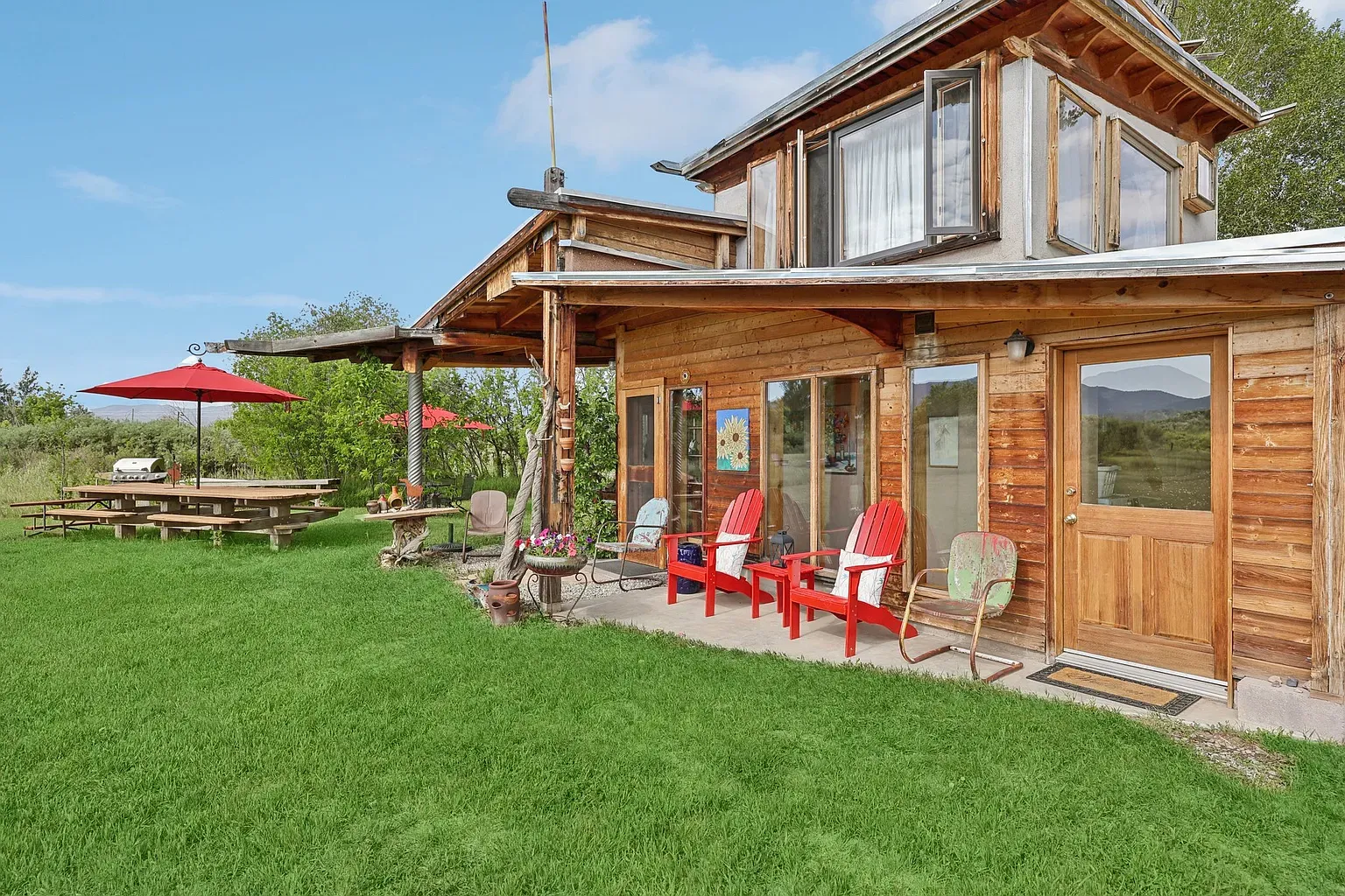 Big cabin windows soaking in the view. You’d never close the blinds.