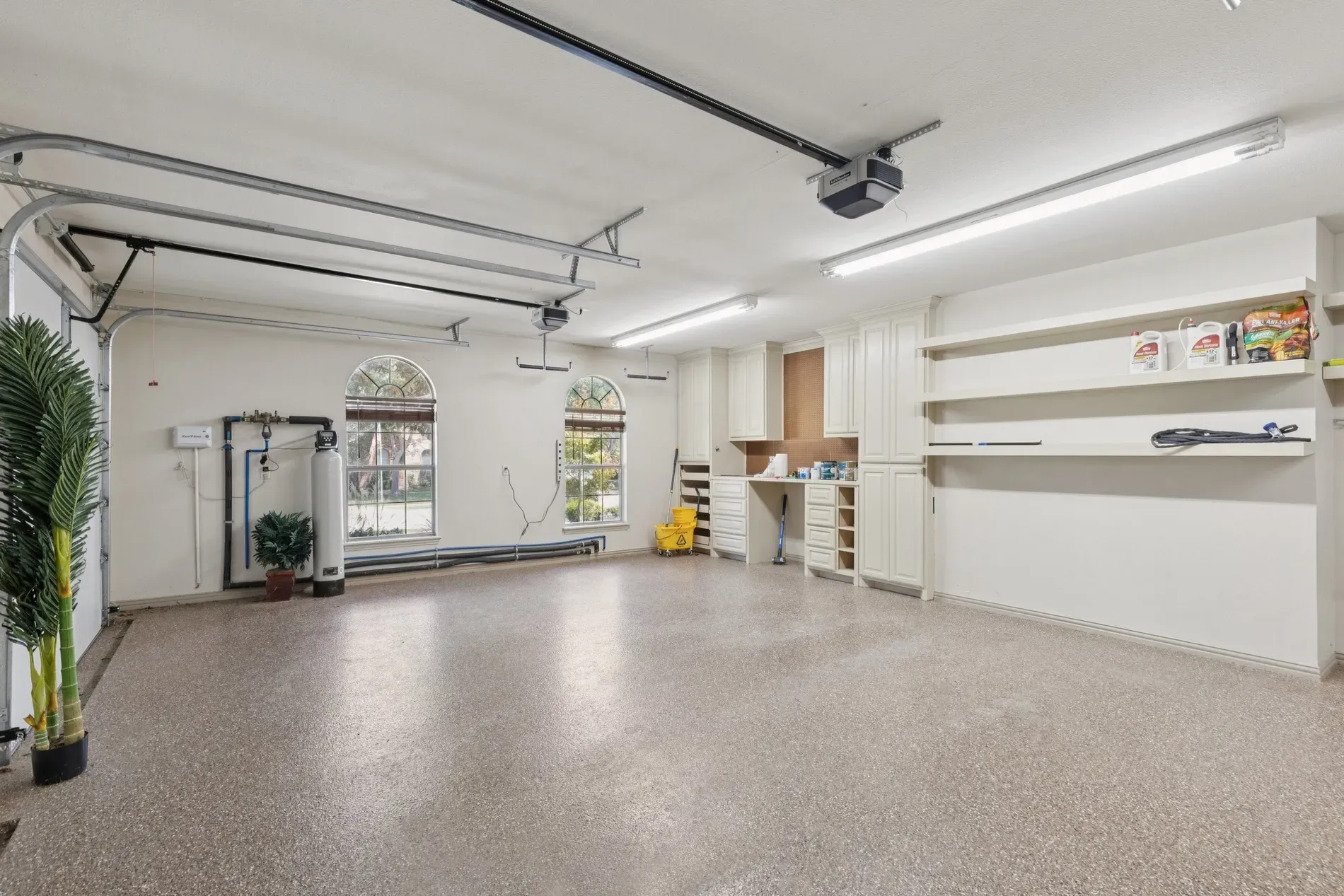 Garage looks spotless. Epoxy floor shining, bright lights, everything labeled and calm.