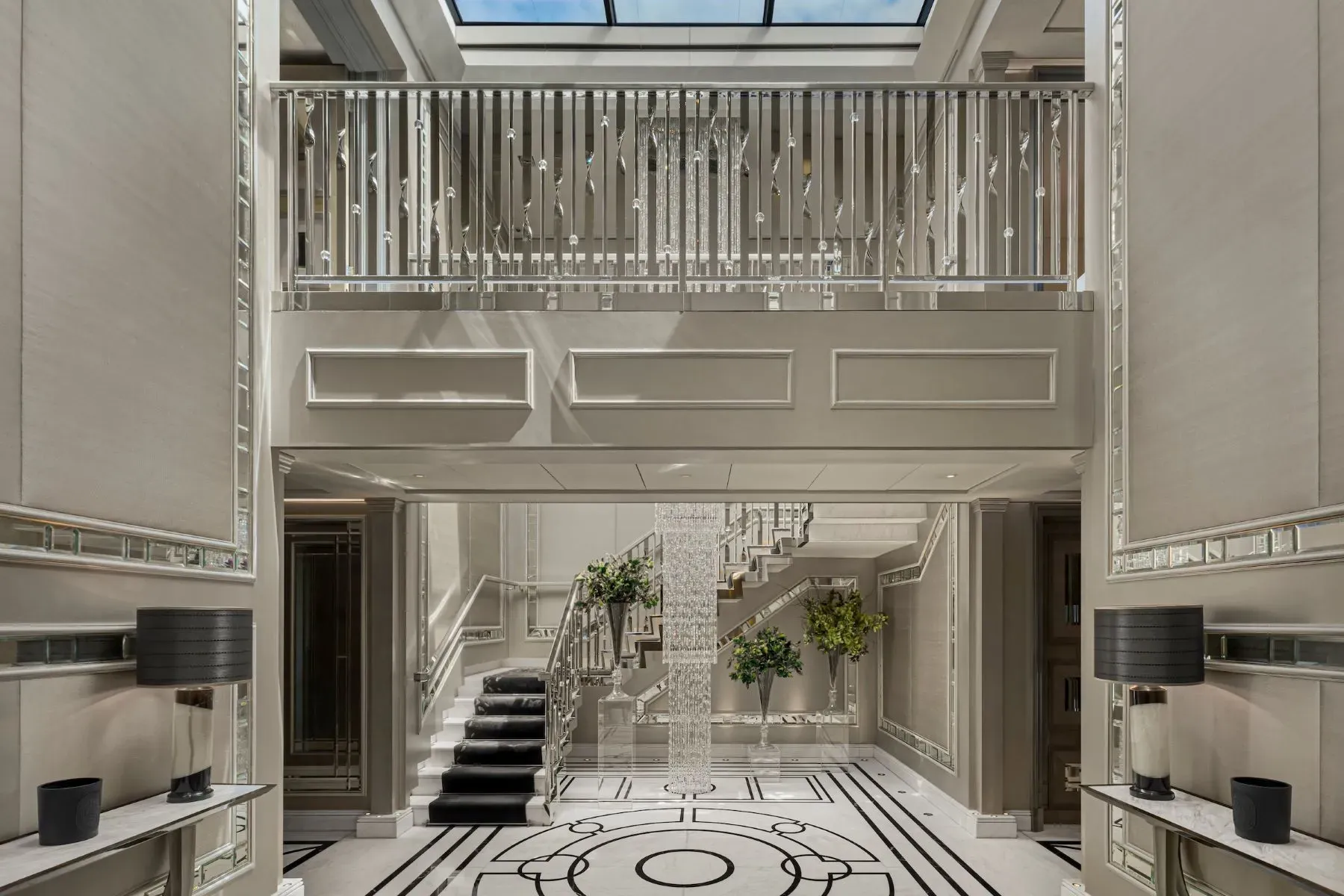 Entry gives Art Deco, black-and-white marble doing the most.