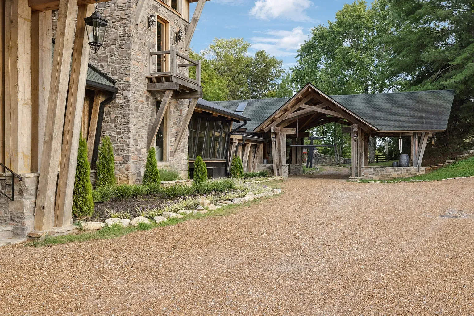 Back outside. Timber and stone flex, with those beams doing the handshake.