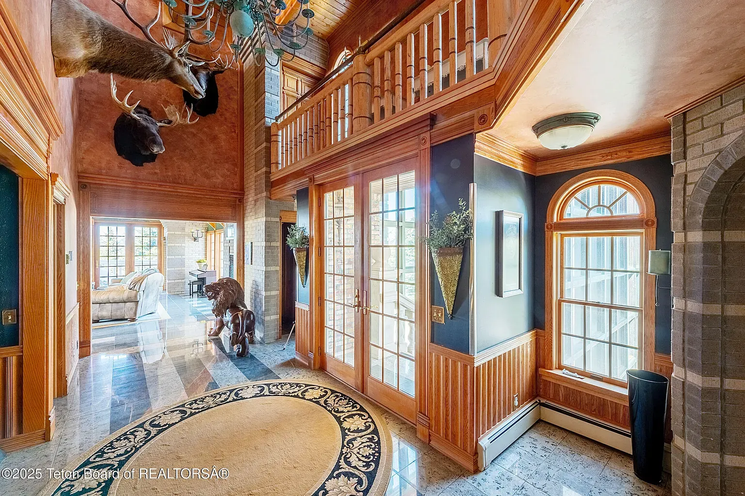 Warm, earthy entry. Wood everywhere, but it still feels fancy.