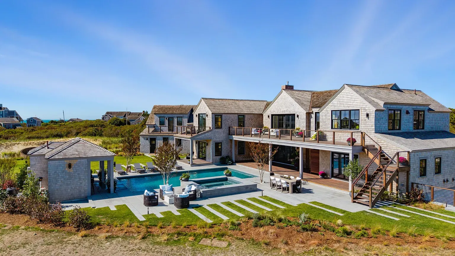 From this angle, the weathered shingles look perfect with the trees.