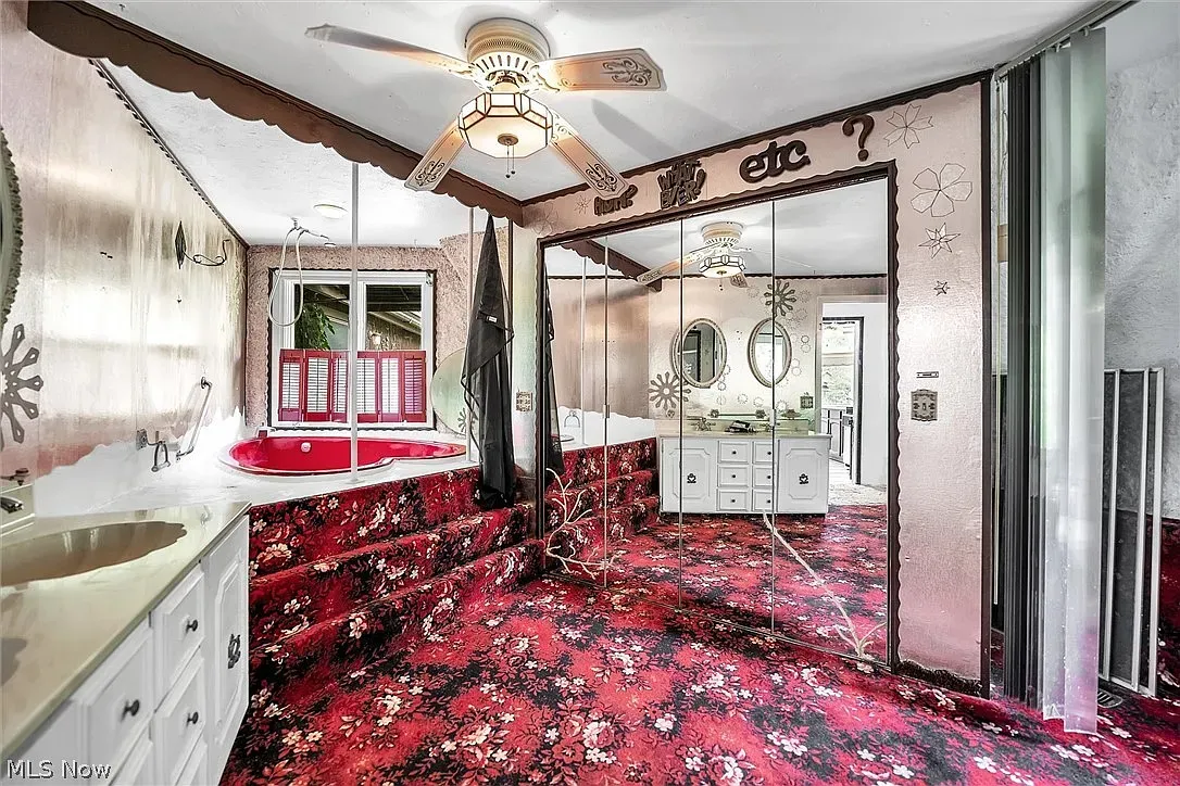 The heart-shaped tub with mirrors. 70s romance novel energy.