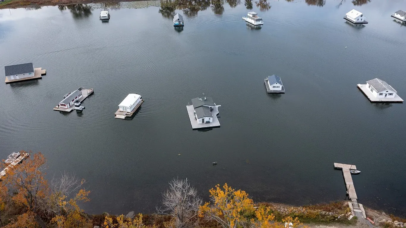 Whole floating neighborhood. Different colors bobbing around, super calm water.