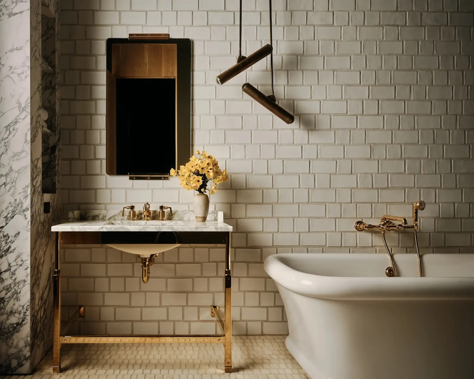 White tub floating in a subway-tile sea. Classic hotel vibes, but nicer.